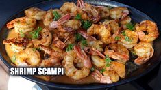 shrimp scampp is being cooked in a skillet