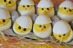 an egg carton filled with eggs decorated like chicks