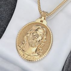 14k Solid Gold Jesus Pendant, Oval Shape Jesus Gold Pendant, 14k Gold Jesus Pendant, Unisex Jesus Pendant, Gift for Her Metal: 14K Solid Yellow Gold (Stamped as 14K) Comes in 14K White, Yellow & Rose Gold Pendant Size: 32mm X 27mm (Bail is not Included with the size) Pendant Weight: 24.25 Grams (Approx.) Bail Opening: 4.0mm - Perfect to use it with thick Chains. If your chain is thicker please contact us. We will be able to make the bail opening bigger accordingly. If you need any changes on this pendant please let us know.  Important Note: The Jesus Pendant does not come with Chain. If you need one please contact us.  Important Note for International Buyers: Please note that we are not responsible for any Import / Custom Charges when the package arrives to your Country Customs. Tarnish-resistant Oval White Gold Jewelry, Oval Gold Plated Jewelry With Polished Finish, Tarnish Resistant Oval Gold Jewelry, Rose Gold Oval Gold-plated Necklace, Oval Gold Tarnish-resistant Jewelry, Yellow Gold Oval Pendant Necklace Stamped 14k, Yellow Gold Necklace With 14k Stamped Oval Pendant, Yellow Gold 14k Stamped Oval Pendant Necklace, Gold Jewelry With Polished Oval Pendant