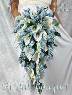 a bridal bouquet with blue and white flowers in the shape of a bride's bouquet