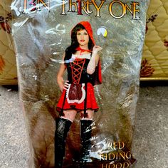 a plastic box with an image of a woman dressed as a red riding hood and boots