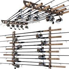 several fishing rods and reels are hanging from a wooden rack on a white background