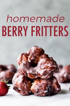 homemade berry fritters stacked on top of each other with strawberries in the background