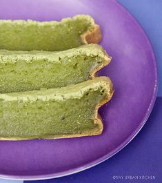 two pieces of bread sitting on top of a purple plate