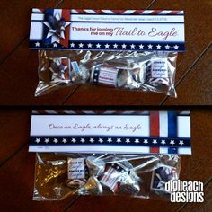 two bags of candy wrapped in plastic on top of a wooden table next to each other