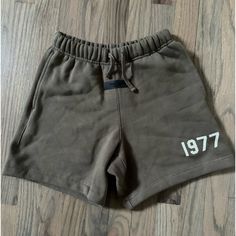 Brand New Essentials Fear Of God Shorts Never Worn, No Tags Kids Size 10, Can Fit A Women’s Xs Brown Short Bottoms For Streetwear, Brown Shorts For Streetwear In Spring, Brown Shorts For Spring Streetwear, Womens Fear Of God Essentials Outfit, Brown Streetwear Shorts, Fear Of God Essentials, Fear Of God T Shirt, Fear Of God Shorts, Fear Of God Shirt