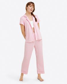 Sleep time never looked so chic. The Linda Pajama Set in Gingham is as comfortable as it is pretty. Constructed from a lush luxe knit, this fabric feels ultra soft and buttery to the touch. Designed with a relaxed fit, this two-piece set features a vibrant pink gingham print, functional buttons, and a stretchy elastic Plaid Cotton Sleepwear For Loungewear, Cotton Plaid Sleepwear For Loungewear, Casual Spring Loungewear Sets, Plaid Relaxed Fit Sleepwear For Loungewear, Cotton Plaid Sleepwear For Lounging, Plaid Cotton Sleepwear For Lounging, Plaid Cotton Loungewear Sets, Cozy Plaid Sleepwear Loungewear, Cozy Plaid Sleepwear For Loungewear