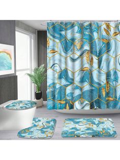 a bathroom with blue and gold decor on the shower curtain, rugs and bath mats