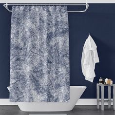 a blue and white shower curtain hanging from a metal bar in front of a bathtub