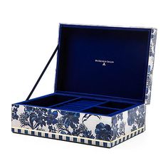 an open blue and white box with flowers on it