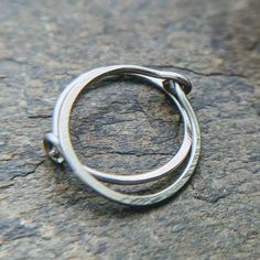 I carefully hand form these hammered hoops from your choice of wire and file the ends and hammer them for a lovely finish. 22g (0.64) hoops are on the thinner side of standard. Select your quantity, metal and inner diameter from the drop-down menus. Shown in 22g titanium, 20g 10mm sterling silver, 20g 8mm gold fill and 18g 10mm gold fill. The final shot shows the 28g 14k white, 26g 14k yellow, 24g 14k pink, 22g niobium and 20g sterling silver so that you can compare colors and thickness. Please Small Hoop Hammered Metal Earrings, Hammered Yellow Gold Hoop Earrings, Hammered Bronze Metal Hoop Earrings, Small Hammered Gold-plated Hoop Earrings, Hammered 14k Gold-filled Hoop Earrings, Golden Copper, Extreme Metal, Nose Hoop, Nose Ring Stud