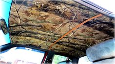 the interior of a car with trees on it