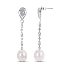 These chic dangle earrings for her feature classic freshwater cultured pearls suspended from 2-inch sterling silver beaded chains. White topaz gemstones sparkle above to finish the look. The sterling silver earrings secure with friction backs. Sterling Silver Pearl Chain Earrings For Anniversary, Silver Chandelier Earrings With Pearl Charm, Elegant Sterling Silver Dangle Pearl Earrings, Fine Jewelry Sterling Silver Pearl Dangle Earrings, Formal Silver Earrings With Pearl Chain, Elegant Silver Chandelier Earrings With Pearl Chain, Formal Pearl Drop Chandelier Earrings, Silver Dangle Chandelier Earrings With Pearl Charm, Elegant Sterling Silver Long Drop Chandelier Earrings