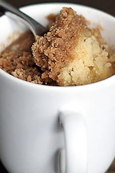 a close up of a bowl of food with a spoon