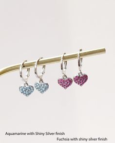 "Are you searching for a birthday, anniversary, graduation, or Christmas gift? Whether you are looking for a gift for the one you love or for yourself these Swarovski crystal heart shaped earrings are sure to become a go to accessory. These heart charm earrings can be customized by finish and crystal color. You'll love the way these crystals sparkle in the sun. Give the woman you love a reminder of just how much you love her. These heart charm Swarovski earrings will remind her of your love for Silicone Ring Women, Tiny Heart Earrings, White Opal Earrings, Crystal Heart Earrings, Heart Hoop Earrings, Heart Pendant Gold, Hoops Earrings, For Her Gifts, Small Charms