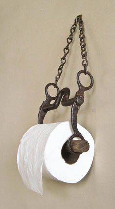 a roll of toilet paper hanging from a chain