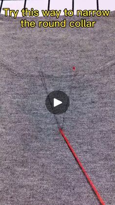 the video is showing how to use an iron on a t - shirt with red thread