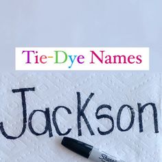 a towel with the word jackson written on it and a marker next to it that says tie - dye names