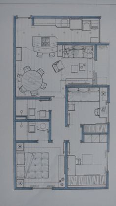 a drawing of a living room and kitchen area in a house with blue lines on the floor