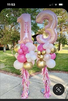 pink and gold balloons with the number thirteen on them