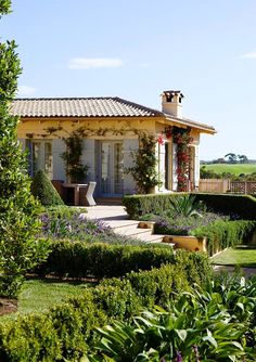 the house is surrounded by beautiful garden and greenery