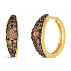 From Le Vian(R), these delicious diamond earrings are fashioned in 14k Honey Gold(tm). An exquisite blend of Chocolate Diamonds(R) decorates the hoop in a beautiful array. Chocolate Diamonds(R) total 1 1/5ctw and SI2 in clarity. Natural fancy brown diamonds are available in shades from champagne to cognac to Chocolate Diamonds(R), Le Vian(R)'s original brand of natural fancy color brown diamonds. Chocolate Diamonds(R) are naturally flavored, the depth of their color determined by the tremendous Chocolate Diamond Earrings, Levian Chocolate Diamonds, Wedding Day Jewelry, Chocolate Diamonds, Brown Diamond, Ring Size Guide, Gold Hoop Earrings, Diamond Studs, Jewelry Branding