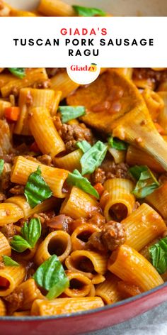 a red bowl filled with pasta and meat