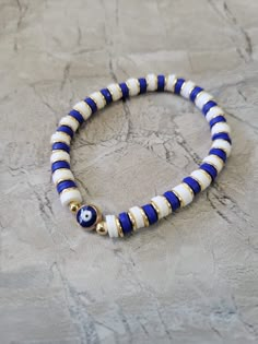 Evil Eye Bracelets Polymer Clay & Disc Beads Stretch Bracelets Colorful Bracelets Beaded Bracelets Evil Eye, Strawberry Clay Bead Bracelet, Cute Bracelet Ideas Clay Beads, Bracelet Patterns Clay Beads, Blue Bracelet Ideas, Evil Eye Friendship Bracelet