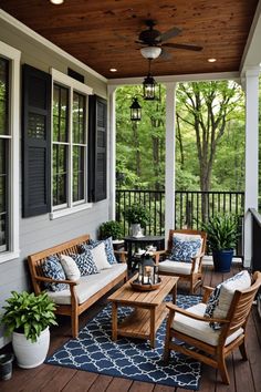 a porch with wooden furniture and blue rugs