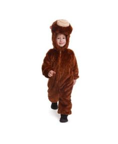 a little boy dressed in a bear costume