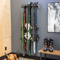 there are many skis hanging on the wall