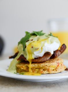 a close up of a plate of food with eggs and other toppings on it