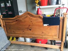 a wooden bed frame sitting in a garage