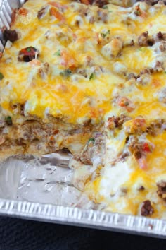 a casserole dish with meat and cheese on it is ready to be eaten