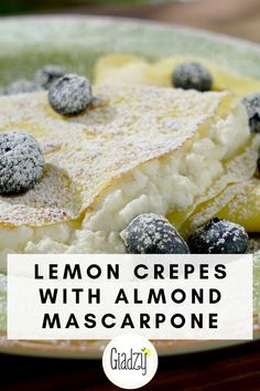 lemon crepes with almond mascarpone and blueberries on a green plate