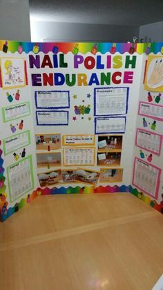 a bulletin board with information about nail polish and other things on it in front of a wooden table