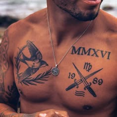 a shirtless man with tattoos on his chest holding a knife and two crossed swords