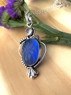 "Beautiful, carved, oval, natural, blue-purplish (depending on the angle, sometimes looks even royal transparent deep blue),chalcedony Pendant necklace, set in a slightly oxidized 925 sterling silver plated copper setting, with 16\" inches long 925 sterling silver chain. --Pendant size: 2.75\"x1.65\" inches, including bail. --Stone Size: 27*20mm. --Stone weight: 10 grams." Blue Carved Oval Jewelry, Blue Oval Carved Jewelry, Bloodstone Necklace, Lapis Lazuli Earrings, Lapis Lazuli Pendant, Silver Prices, 925 Sterling Silver Chain, Blue Chalcedony, Oxidized Silver