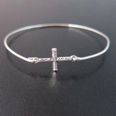 Description This delicate cross bracelet makes a great gift for religious weddings and to remind her of her faith. Request a Custom Order Join more than 89 thousand delighted customers! - - - - - - - - - - - - - - - Sizing Pick from the easy size chart below or measure circumference of widest part of hand while reaching thumb toward pinkie to make hand narrow. Measure in this position since bangle slides over hand. All of my bangles are clasp-free, slide on over the hand for easy on, easy off. P Christian Bracelets Faith, Christian Jewelry Bracelets, Silver Cross Jewelry, Family Tree Bracelet, Silver Cross Bracelet, Faith Bracelet, Christian Bracelets, Faith Jewelry, Christian Jewelry