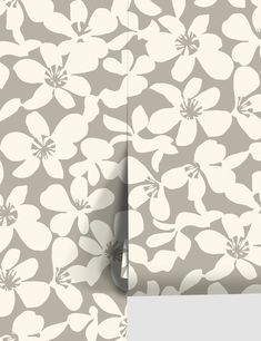 a wallpaper with white flowers on blue and gray background, which is cut in half