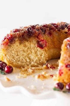 a piece of cake with cranberries on it