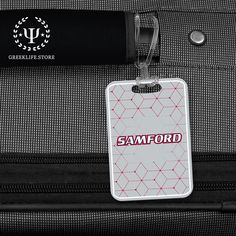 • PREMIUM QUALITY MATERIAL: Samford University Custom Made Rectangular Bag Tag is made from high quality durable plastic. • DIMENSIONS: The luggage tag measures 4” H x 23/4” W. • IMPECCABLE GRAPHICS: Samford University Rectangular Bag Tag features custom graphics along with the logo, motto, and the name of Samford University. • PERFECT TRAVEL ACCESSORY: Show pride for your Samford University everywhere you travel. This Samford University is the perfect accessory for any bag! Durable elastic stra Functional White Rectangular Luggage, White Rectangular Luggage Tag For Travel, Black Rectangular Luggage Tag For School, Samford University, Custom Graphics, Luggage Bag, Bag Tag, Luggage Tag, Bag Tags