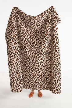 an animal print dress with ruffles on the shoulders