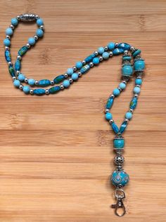 One-of-a-kind 16 inch beaded turquoise and silver lanyard. Adjustable Beaded Blue Lanyards, Adjustable Blue Beaded Lanyards, Turquoise Glass, Badge Holders Lanyard, Badge Holders, Lanyard, Beauty Book, Etsy Accessories, Bathing Beauties