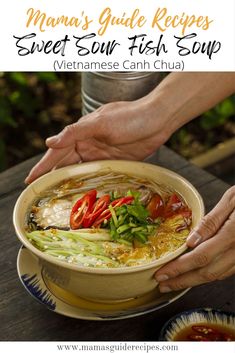 a person holding a bowl filled with food on top of a wooden table