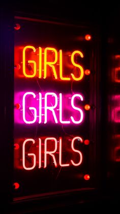 a neon sign with the words girls on it