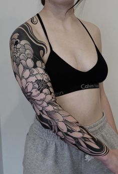 a woman with a tattoo on her arm