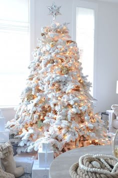 a white christmas tree in a living room