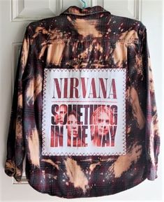 a tie dye jacket with the words nirvana on it