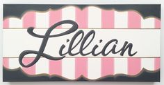 a pink and white striped sign with the word ellen written in cursive writing